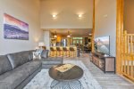 Living room with leather furniture and large tv