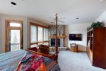 Master bedroom with king bed and gas fireplace