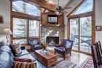 Spacious living room with floor to ceiling windows