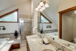 Ensuite bathroom with separate shower and large jetted tub