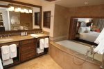 En suite bathrooms with a separate jacuzzi tub and steam shower