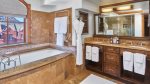 En suite bathrooms with a separate jacuzzi tub and steam shower