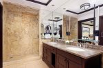 Primary Bathroom features jetted soaking tub and rain shower