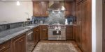The gourmet kitchen is a culinary artist`s dream, featuring a professional Wolf range
