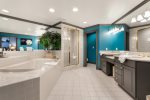 Large Primary Ensuite with Double Vanity, Soaking Tub, Walk In Shower and Private Water Closet.