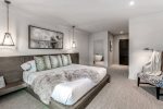 Primary Bedroom features a king bed and ensuite bedroom with expansive walk-in closet