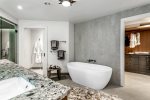 Primary Ensuite Bath features a freestanding soaking tub