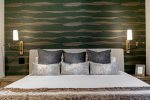Continue down the Level 2 Hall to find Bedroom 4 featuring a king bed