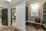 Mudroom and the Primary Bedroom and Guest Bedroom 2 can be found just down the hall.