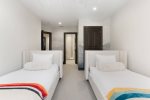 Guest bedroom 2 featuring twin beds, perfect for family or friends