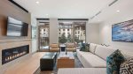 Vaulted ceilings, a gas fireplace, and a sectional sofa