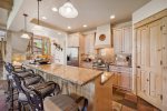 Gourmet Fully Equipped Kitchen with Bar Stools