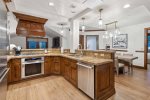 Superb kitchen with Viking and Thermador appliances including a gas range and wine refrigerator