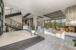 Indoor pool with cascading infinity hot tub, upper patio mountain-view hot tub overlooking a full panorama