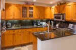 Updated kitchen w/ granite countertops & stainless steel appliances