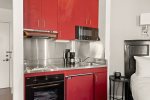 Kitchennette w/ wet bar, refrigerator, granite countertops
