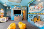 So many fun surprises for everyone in this bedroom, including a 70-inch SMART TV and Minion-favorite banana bean bags