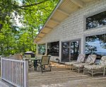 The large deck with plenty of comfortable seating and a gas grill