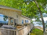 The large deck with plenty of comfortable seating and a gas grill