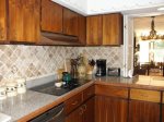 Kitchen with pass through window into dining area