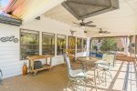 Relax on the back covered deck. Shade for the Summer