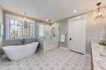 Master bath with large walk in shower and separate tub