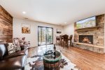 Lost Cabin living area with glass door to balcony