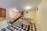 Game room with basketball hoop and foosball