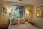 Queen bed and lake view from guest bedroom 2
