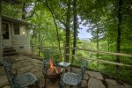 Rustic rock pavers at firepit gathering area and mountain skyline view