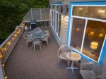 Relax under string lights on the private deck, perfect for evening meals or morning coffee.