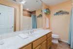 Guess bathrooms with shower and tub options