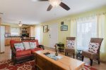 Living room features a queen fold-out sofa bed