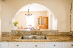 Hacienda... arches and tile with hardwoods