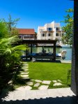 back art to covered boat slip and fishing dock with cleaning station
