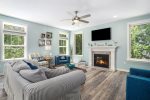 Indulge in a Serene Morning by the Fireplace in the Coastal Living Room of Atlantic Haven