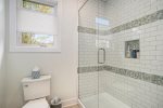 The Queen Suites` Bathroom Emanates Luxury in the Sleek Walk-in Shower for Heated Steams