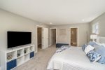 Relax in the Master King Suite - Complete with a Cozy Bed and TV for Movie Nights In