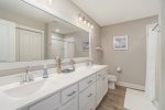 The Master En Suite is a True Treasure - Featuring a Spacious Vanity, Pristine Countertops, and a Mirror for the Perfect Start to Your Day