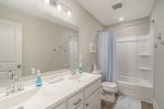 Get Ready for a Day of SoHa Adventure in the Upper-Level Guest Bathroom, Featuring a Convenient Tub and Shower Combo