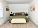 Spacious main-floor king bedroom designed for rest and relaxation.
