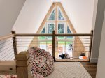 The kids favorite spot  tucked upstairs with a birds-eye view of the cabin below.