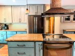 Every detail counts, custom cabinetry, warm granite countertops, and a show-stopping copper range hood make this kitchen as beautiful as it is functional.