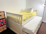 Tucked in and ready for funthis cheerful bed/trundle combo is perfect for kids, cousins, or late-night giggles.