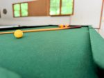 Rack em up The game room features a full-size pool table perfect for friendly competition after a day at the beach.