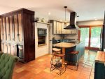 Where meals turn into memories. This beautifully stocked kitchen is both a cooks dream and a warm gathering spot, with handcrafted details and forest views.