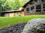 Tucked into the trees, Wildhaus welcomes you with mid-century lines, wall-to-wall windows, and ten acres of peaceful, private beauty.