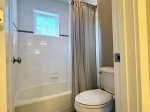 This Jack and Jill bathroom connects the bunk room and a second king bedroom offering privacy, functionality, and a full tub/shower combo.