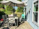That turquoise drink cart isnt just cute, its calling your name. This cheerful deck is the perfect place to kick back after a day at the beach.