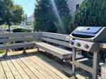 Boats in the distance, burgers on the grill. This cozy corner of the yard turns everyday meals into something special.